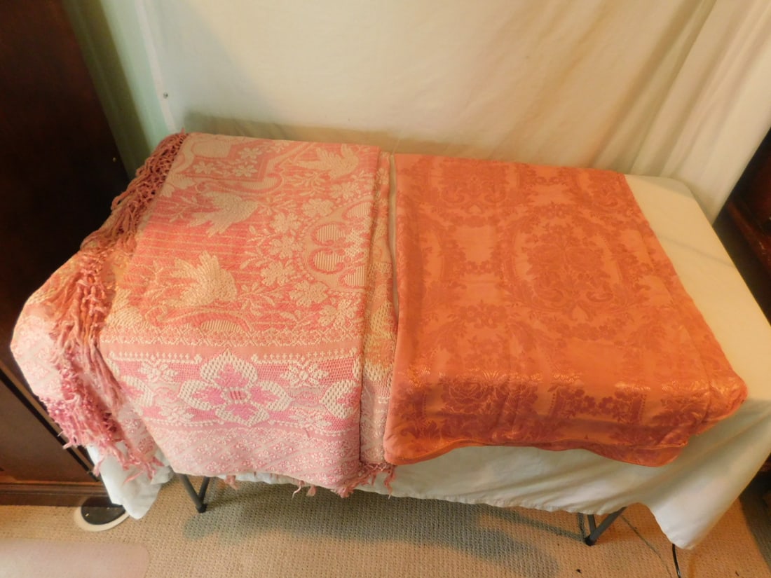 Vintage Table Cover & Bedspread: Vintage Table Cover and Bedspread, both in rose pink including: linen floral design table cover and bedspread in floral geometric design, tasseled end. CONDITION: Good. No issues identified.