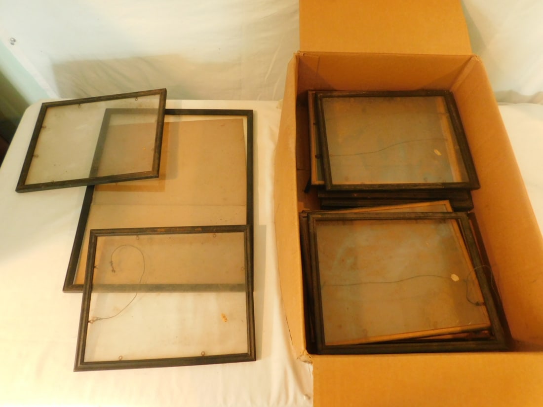 Assorted Small Wood Frames: Assorted Small Wood Frames, including: ten 8 3/4" x 10 3/4", plus one 12 1/4" x 15 1/4", frames empty. CONDITION: Needs cleaning, some glass loose form frame.