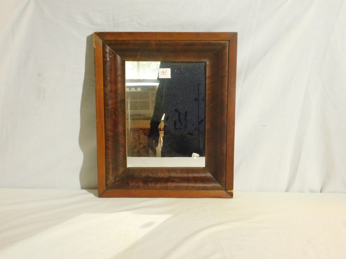 Walnut Victorian Wall Mirror: Walnut Victorian Wall Mirror, ogee frame with burled interior veneer wood, 14 1/2" x 17 1/2', 8 1/2" x 11 1/2" mirror image. CONDITION: A few spots of wood wear on outer frame, some veneer loss on edg