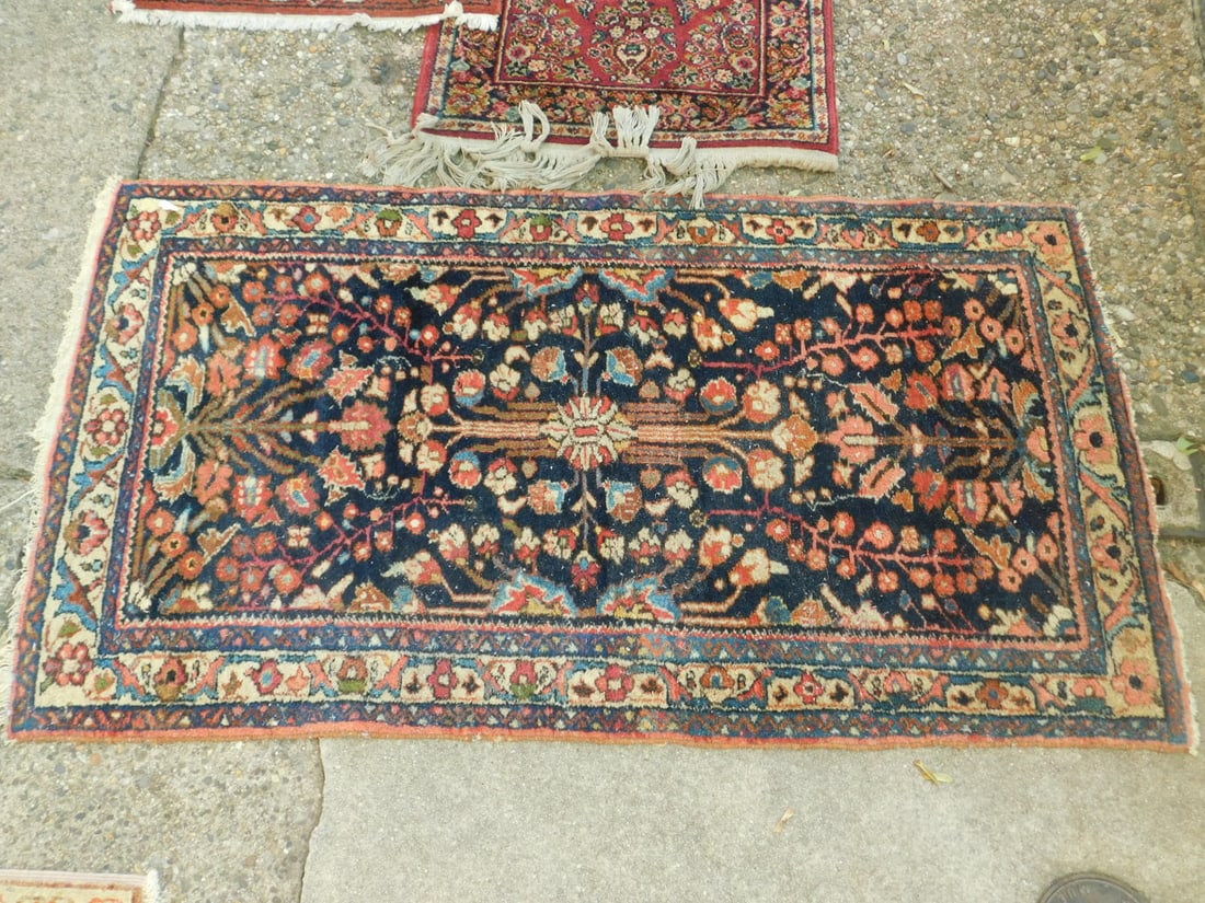 Hammond Throw Rug: Hammond Throw Rug, black ground with reds, beige, tree and floral design, early 20th C, 57" x 32". CONDITION: Good. Fringe losses, needs vacuuming..