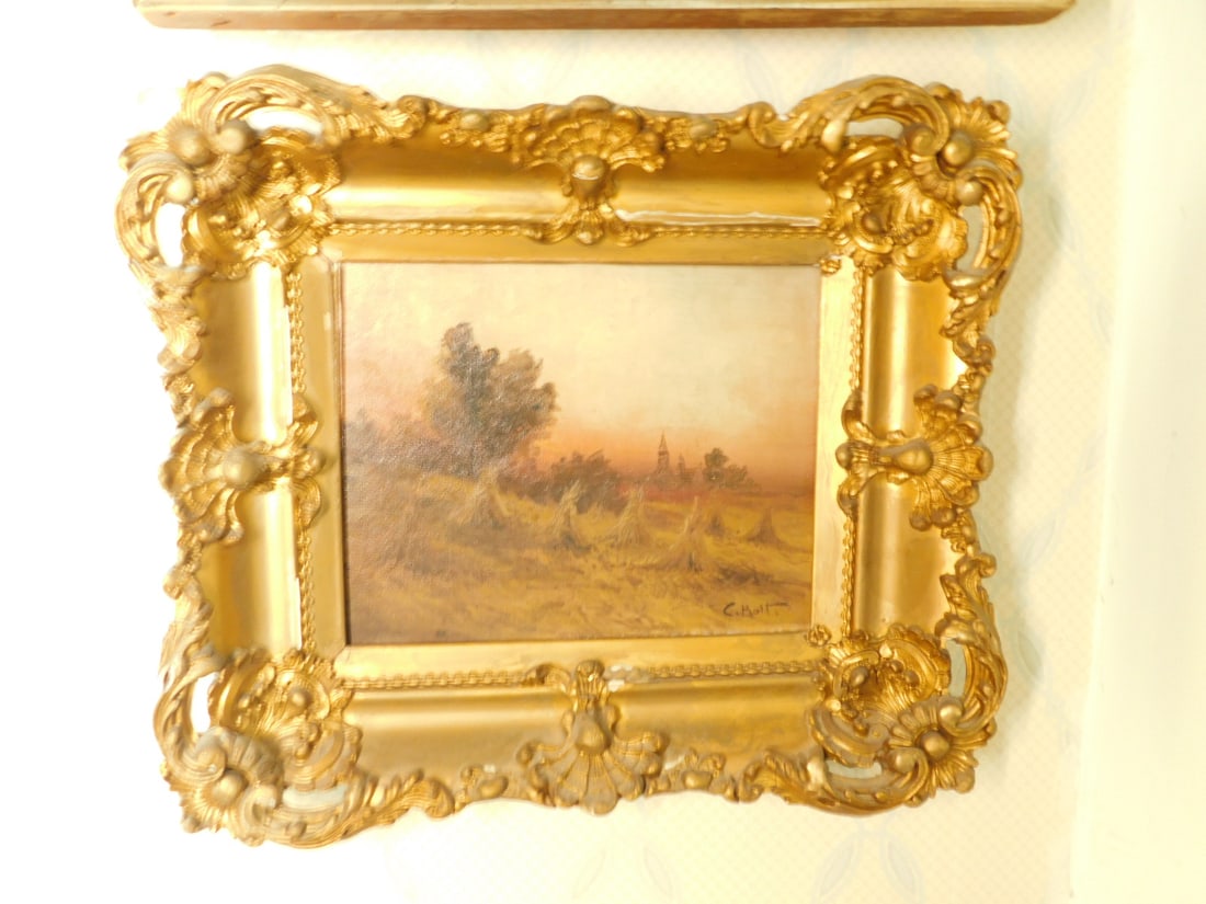 C Holt Landscape Painting: C Holt Landscape Painting, signed lower right, oil on canvas, field of wheat sheaves with distant church, image 8" x 10", carved and gilt frame 13" x 15", early 20th C. CONDITION: Losses and over pain