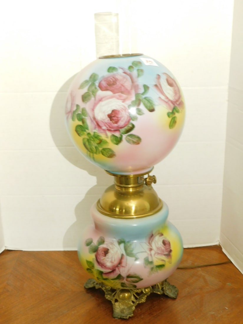 Gone With The Wind Lamp: Gone With The Wind Lamp, EM & Co brass font and mechanism, red rose transfer on opalescent glass shade and base, electrified height to chimney top 26". CONDITION: Very fine.