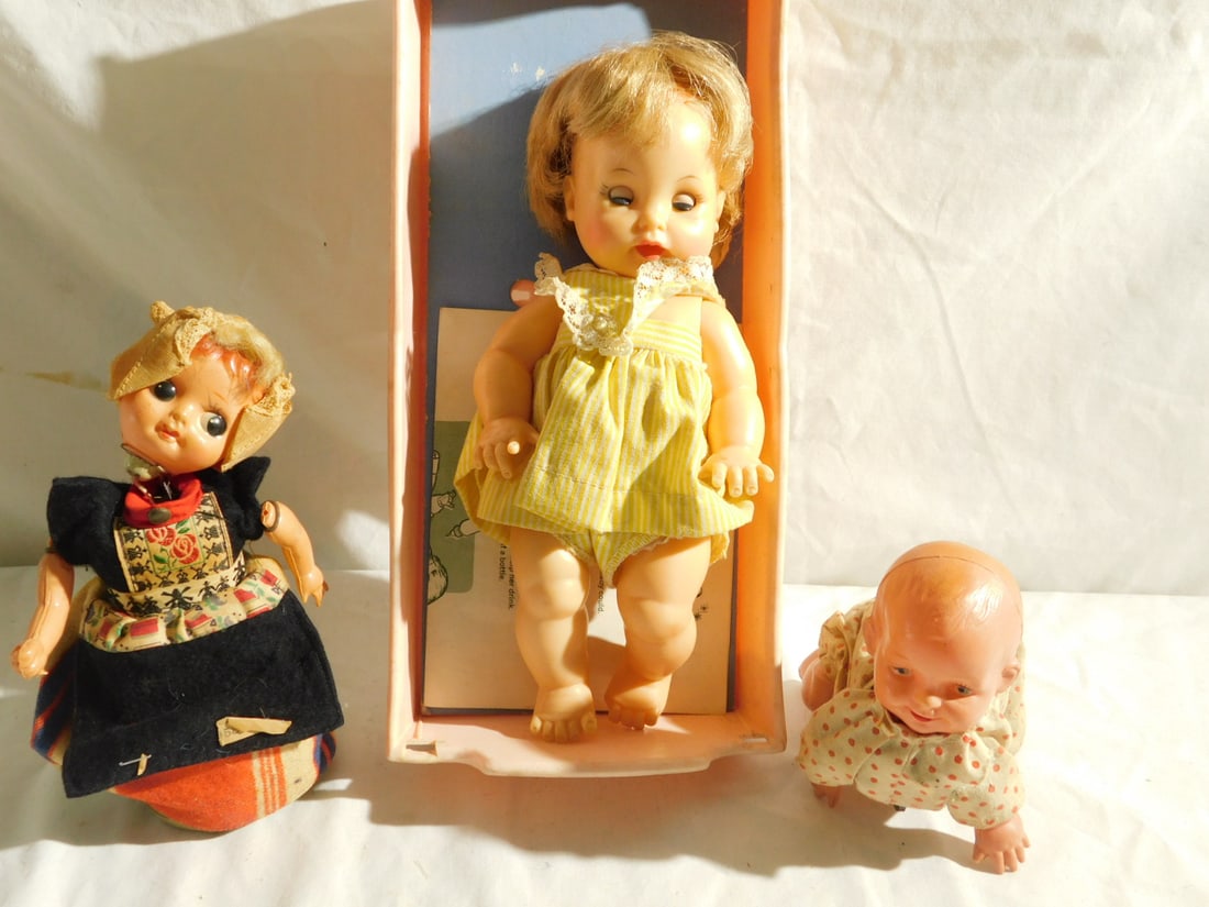 3 Vintage Dolls: Three Vintage Dolls, includes: wind-up celloid crawling baby 4 3/4"l, Holy Elcee - Holland celloid and metal wind up walking girl 6 1/2"h and a Ideal Tearie Dearie - Drinks - Wets and crying 8 1/2" do