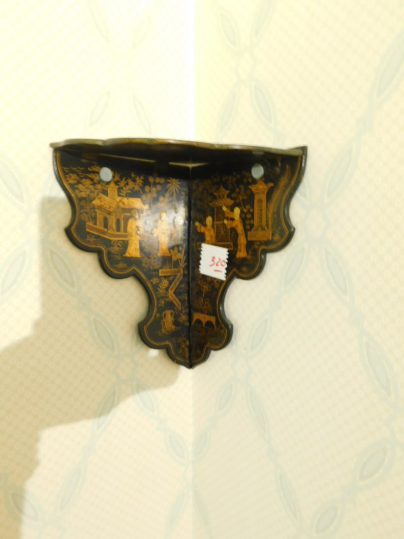 2 Japanned Corner Bracket Shelves: Two Japanned Corner Bracket Shelves, Chinese, black paper mache with gold painted figures, 19th / 20th C, 8" and 10"h. CONDITION: Good.