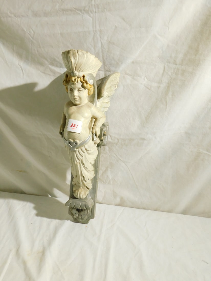 Angel Wall Carving: Angel Wall Carving, cast plaster and painted crowned angel on acanthus plinth, 20th C, 17"h. CONDITION: Crazed paint, repaired break.