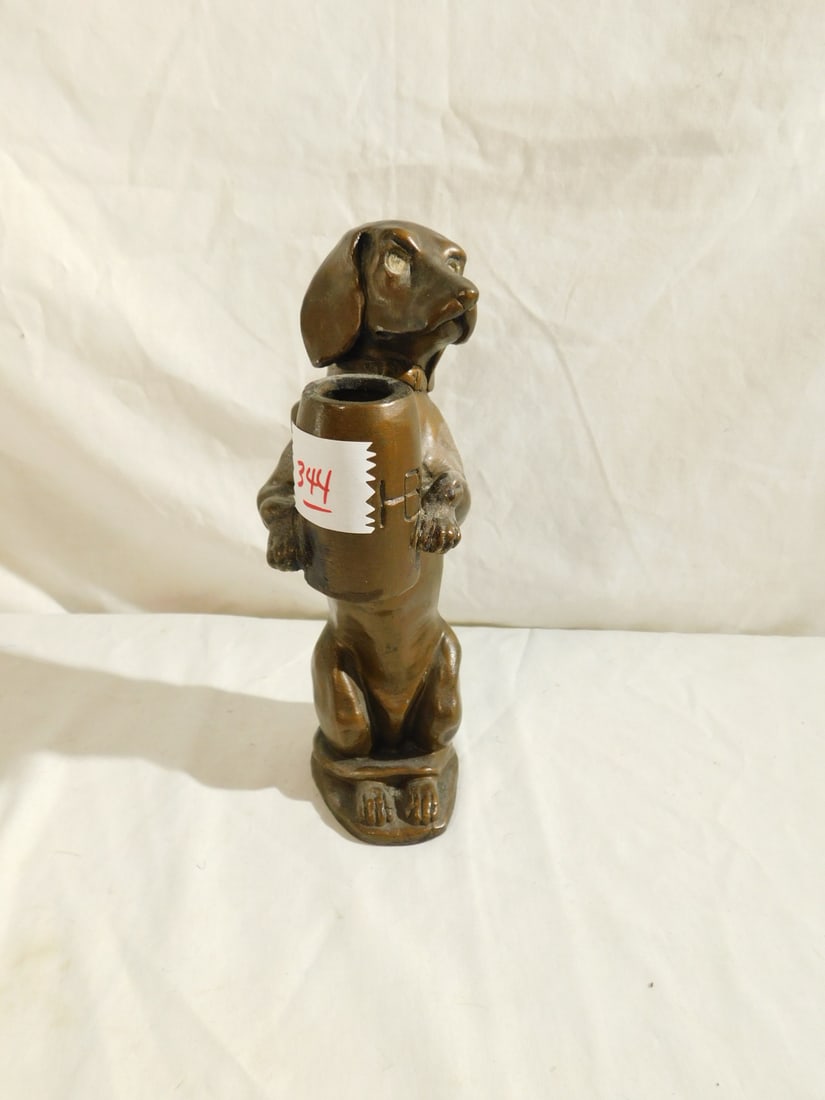 Dog Sculpture: Dog Sculpture, bronze finished composition, standing dog, holding beer mug, 8"h, early 20th C. CONDITION: Very good.