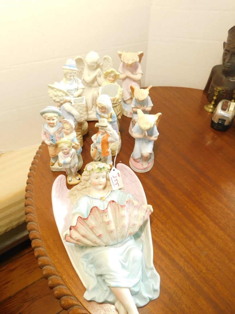 11 Bisque Figures: Eleven Bisque Figures, most 19th C, Germany, includes: singles, couples, angels, spill vases and holy water font from 4 1/4" to 11". CONDITION: Mostly very good. A few with tiny flakes; Holy water fon