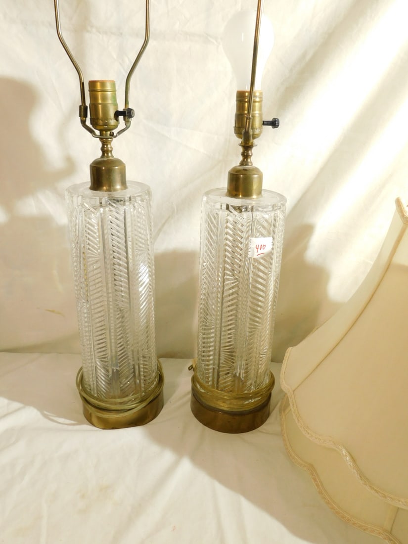 Pr Crystal Lamps: Pair Crystal Lamps, Waterford style on round metal bases, 12 1/2" glass, 27" overall height with two silk shades. CONDITION: Needs cleaning.