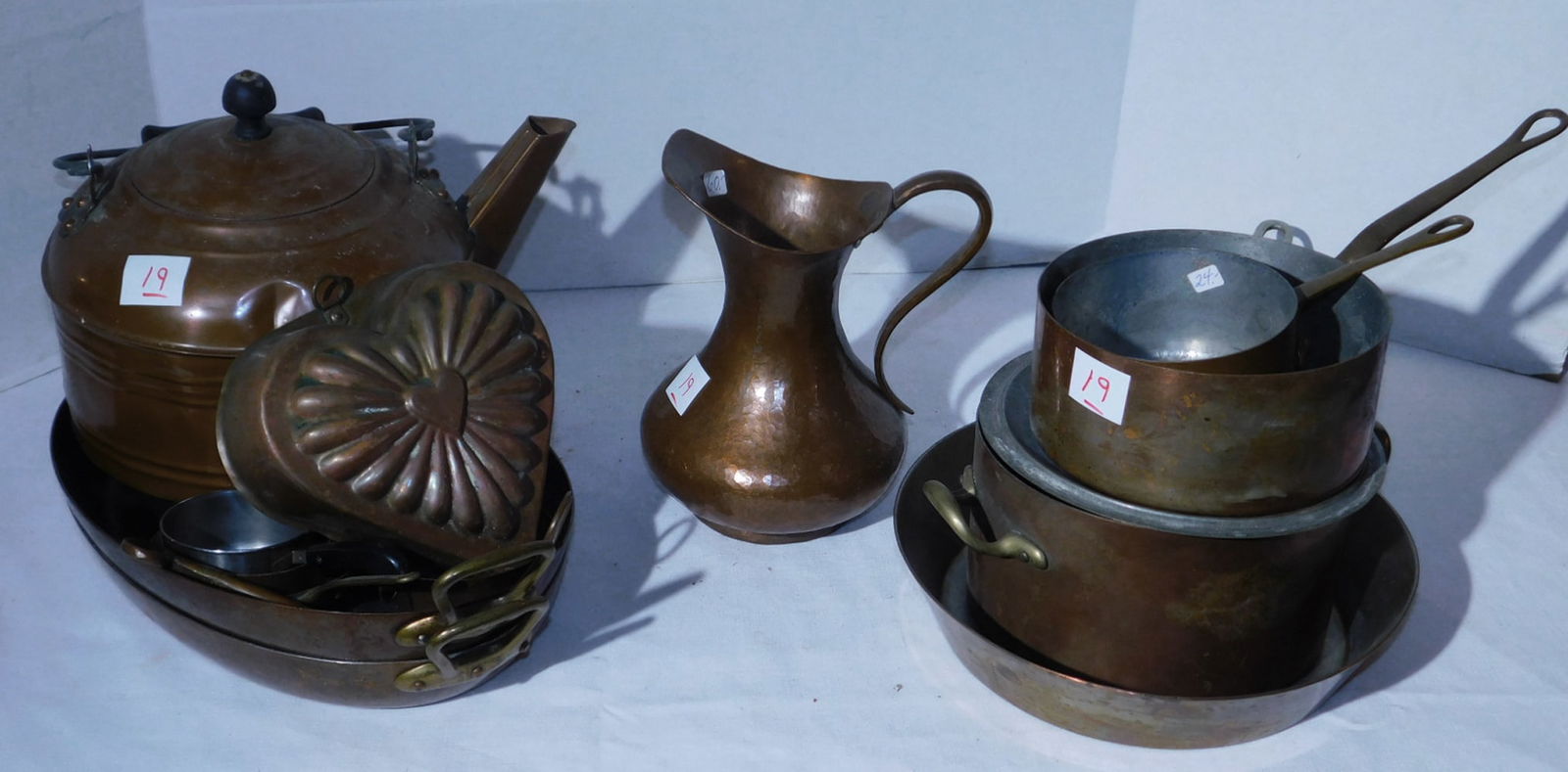 Copper Cookware: Copper Cookware including: (2) 16" x 9" oval pans, 14" fry pan, 8" diam., covered pot, 4 1/2" x 6 1/2" diam. pots, heart form mold, hammered 8" pitcher and tin plated over copper 10" coffee pot, etc.