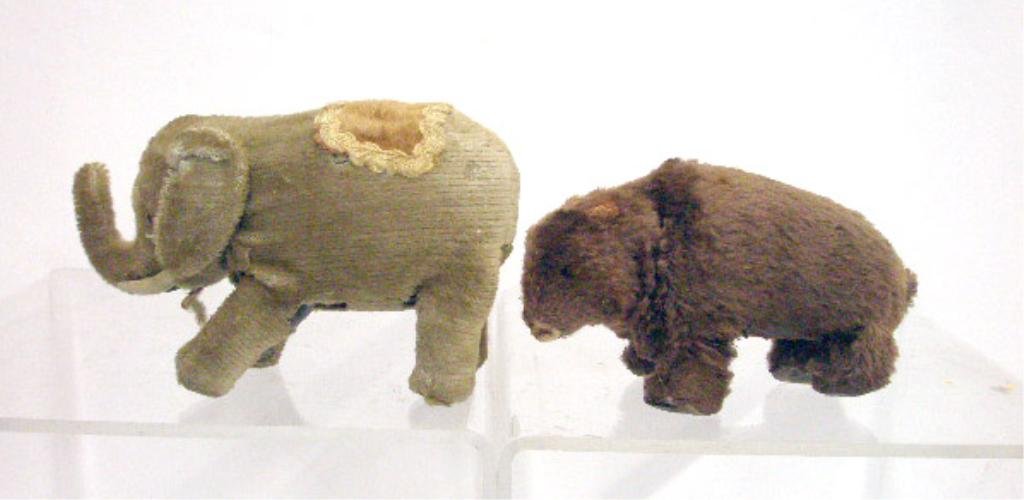 Japanese Wind-Up Walking Bear & Elephant: 1940's Japanese wind-up Walking Bear and Elephant, bear is made in Occupied Japan. CONDITION: Bear moves sporadically, elephant does not work, both have areas with wear and or loss.