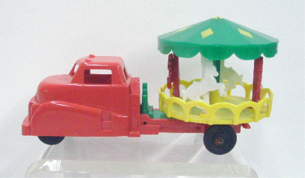 1950's Ideal Plastic Carousel Truck: 1950's Ideal Toy Co. hard plastic Carousel truck. CONDITION: Very good with minor wear, rust on metal tire bars.