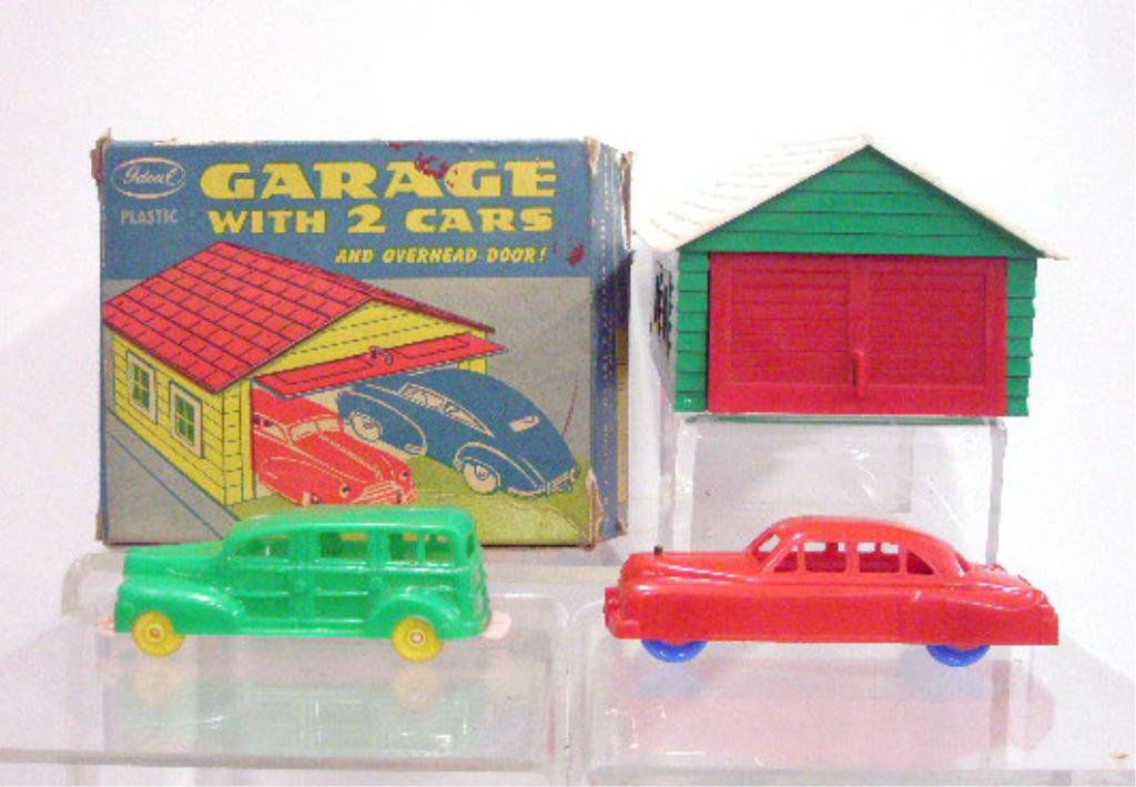 1950's Ideal Plastic Garage With Cars: 1950's Ideal Toy Co. hard plastic Garage with 2 cars, with box. CONDITION: Green car is by Banner, all have some form of wear, box has wear & tearing.