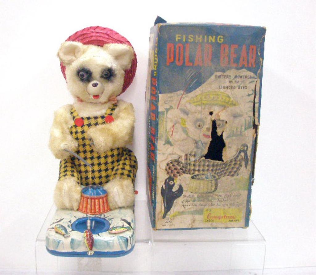 1950's Battery Operated Fishing Polar Bear: 1950's Alps Co. Japanese battery operated Fishing Polar Bear with box. CONDITION: Only working function is eyes lighting up, missing left hand, box has wear & tearing.