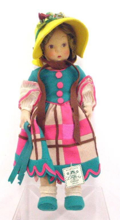 Vintage Lenci Felt Girl Doll: Vintage Lenci all felt 12 1/4" young girl doll. CONDITION: Areas with holes in felt, minor wear.