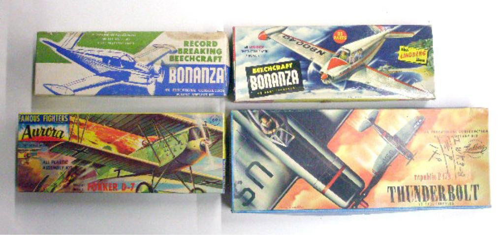 1950's Airplane Model Kits: Four 1950's airplane model kits with boxes, Olin Products Record Breaking Beechcraft Bonanza, Lindberg Products Beechcraft Bonanza and Republic P47N Thunderbolt and Aurora Plastics Corp. W.W. I Fokker