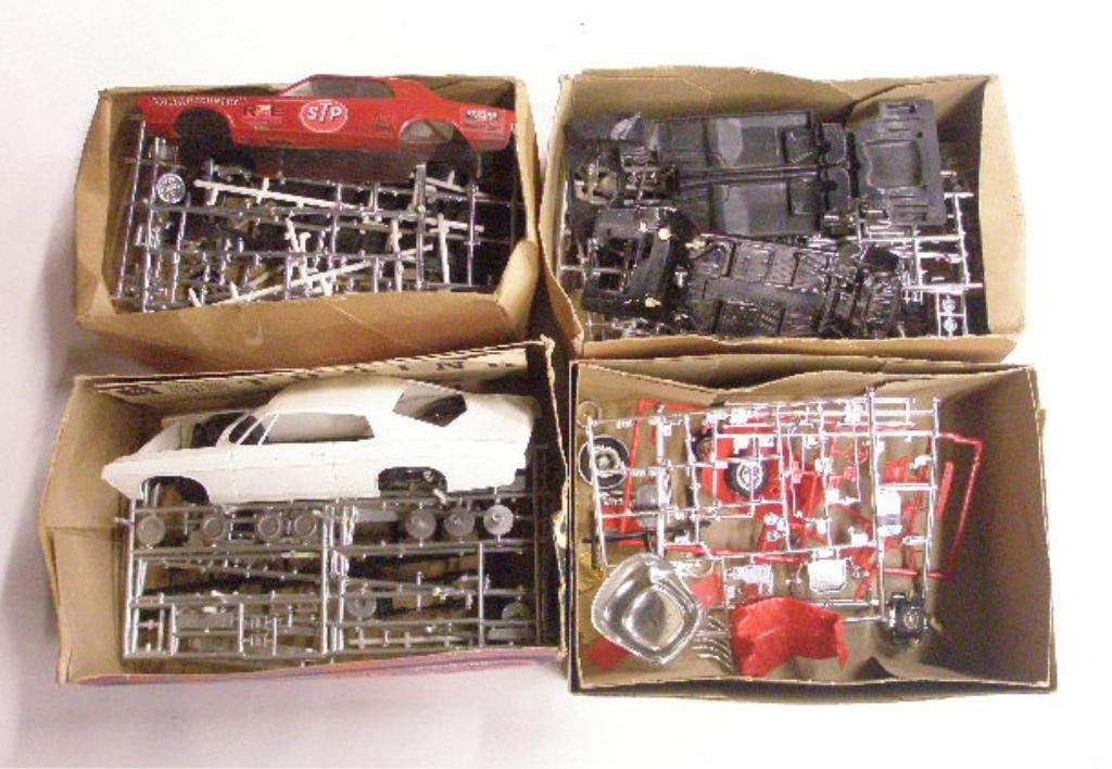 1960's Car Model Kits: Four 1960's car model kits with boxes, AMT Corporation 1968 Ford Fairlane Torino (top portion of box only), Mercury Cougar (bottom portion of box only) and unknown (bottom portion of box only) and Mon