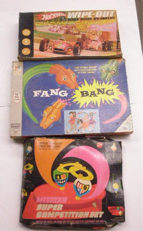 1960's Mattel & Milton Bradley Games: 1960's Mattel Inc. and Milton Bradley Company games with boxes, Mattel Wizzer Super Competition set and Hot Wheels Wipe Out Race and Milton Bradley Fang Bang. CONDITION: All have wear and missing piec