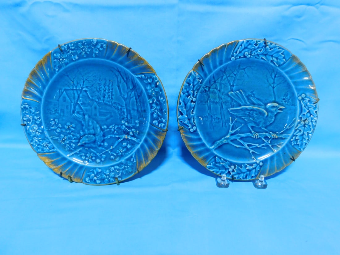Pr Majolica Plates: Pair Majolica Plates by Sarreguemines, blue glazed, depicts molded birds in floral rims with gold highlights, 8"d, circa 1900. CONDITION: Very fine.