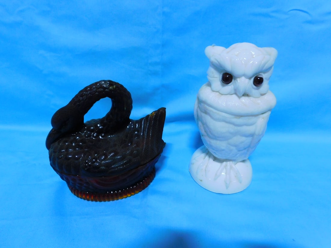 Owl & Swan Covered Jars: Owl & Swan Covered Jars, includes: ruby amberina, molded glass swan on base, Heisey style mark on base, mid 20th C, 5 1/2" x 5 1/2" and a late 19th C, milk glass owl with amber glass eyes, 6 3/4"h. CO