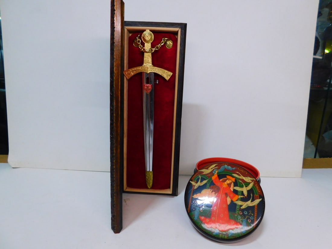 Russian Sword & Box: Russian Sword and Box, box mini sword "Millennium 966 - 1966 SZRZERBIRR" cylindrical box - maiden with birds 3 3/8"d, 2 1/4"h. CONDITION: Very fine.