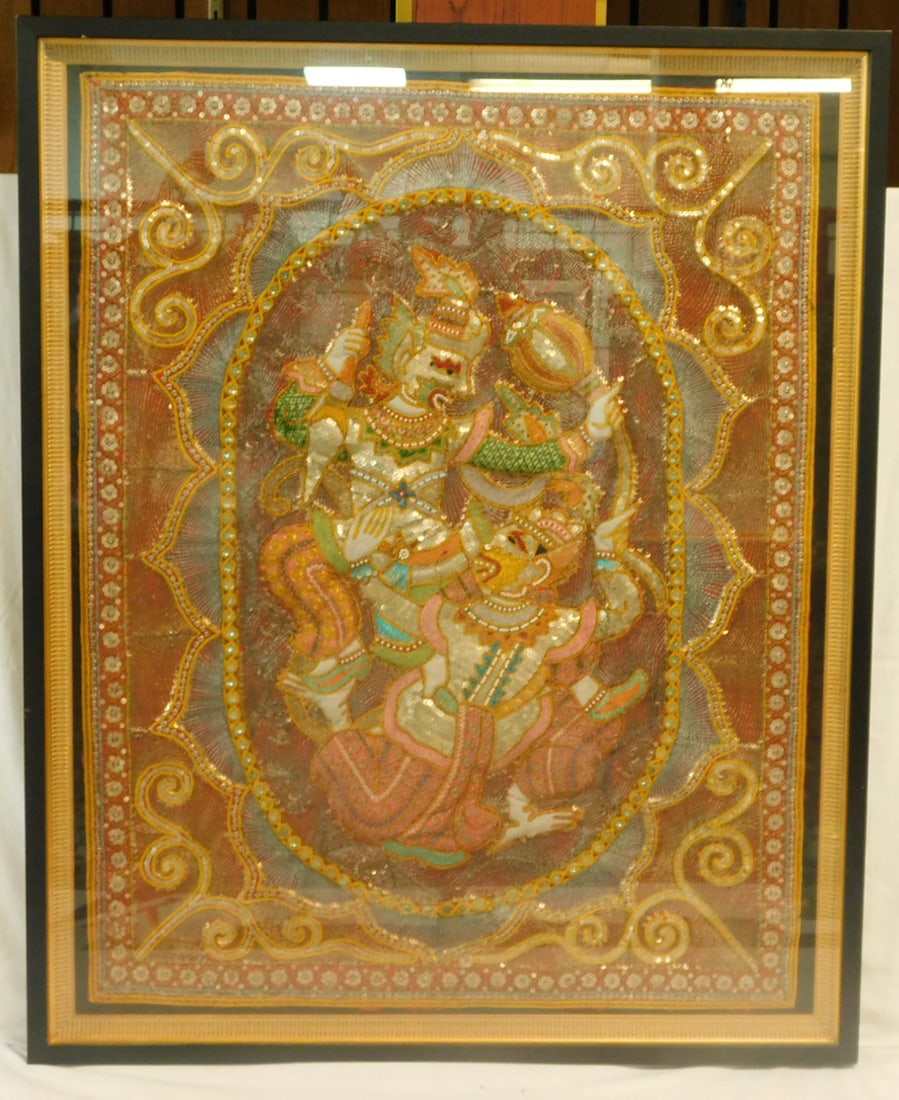 India Framed Embroidery: India Framed Embroidery, gold and silver threads, sequins and beads on cloth, with puffed out dueling immortals, 20th C, in ebonized and gilt wood frame 35 1/2" x 28". CONDITION: Excellent. Not examin