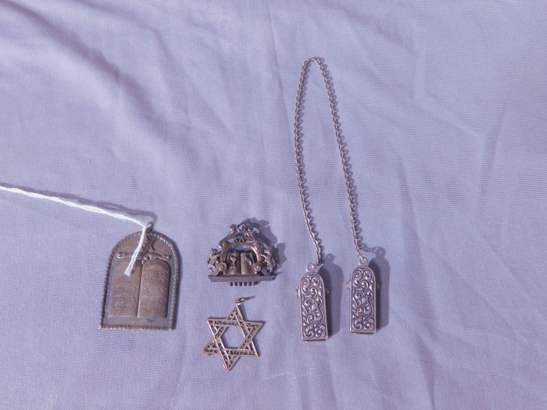 Judaica Sterling Jewelry: Judaica Sterling Jewelry, both marked or tested silver, includes: arch pendant with Ten Commandments and Star (1 1/2" x 2"), filigree Mogen David drop 1 /4", a chained pair of scroll repousse Tallit c