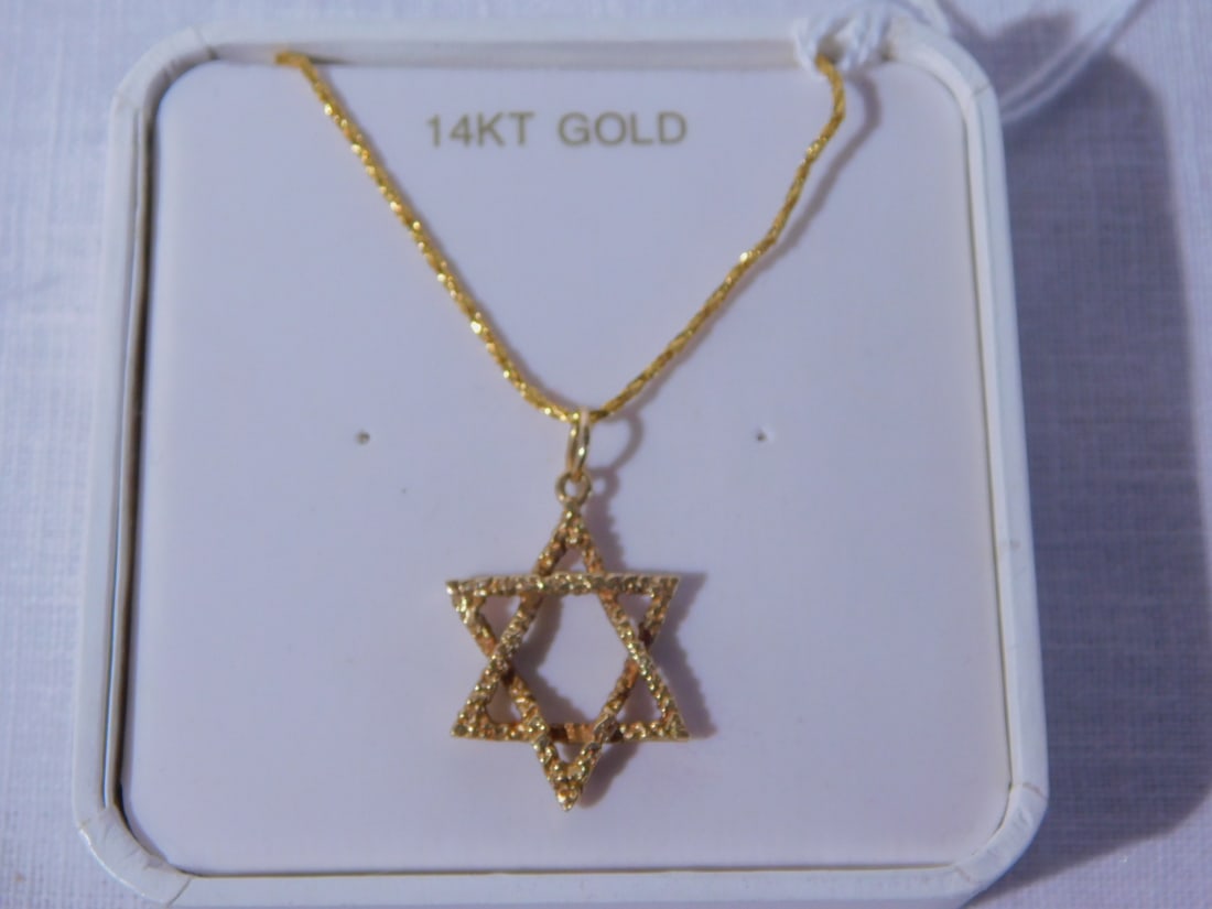14k Yellow Gold Mogen David on Chain: 14k Yellow Gold Mogen David on Chain, the 7/8" Star hangs from 17" chain with spring ring clasp, 2.6 DWT. [249] CONDITION: Very fine.