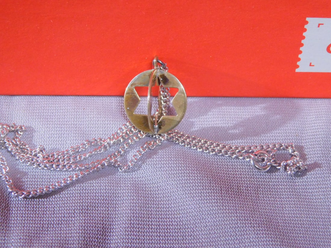 12 Sterling Star Necklaces: Twelve Sterling Star Necklaces, Reed & Barton sterling silver; two joined disks with Mogen David's cut out; sterling 18" chain; vintage new in boxes, circa 1950s-60s. [22] CONDITION: Vintage new in bo