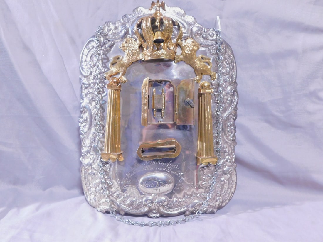 Torah Breastplate: Torah Breastplate, silver and gold wash; Continental 84 silver and European maker's touch marks, floral repousse and hand chaised; Lions of Judah hold a bird crested crown with one bell; over an ark w