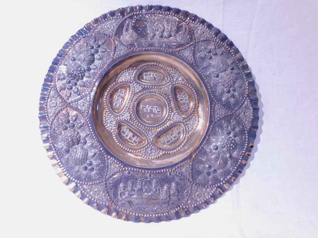 Large Silver Seder Plate / Charger: Large Silver Seder Plate / Charger, marked 835, silver, high relief repousse and chaised with a border cartouches of figures at seder table, between pomegranates and other fruit clusters, the center w
