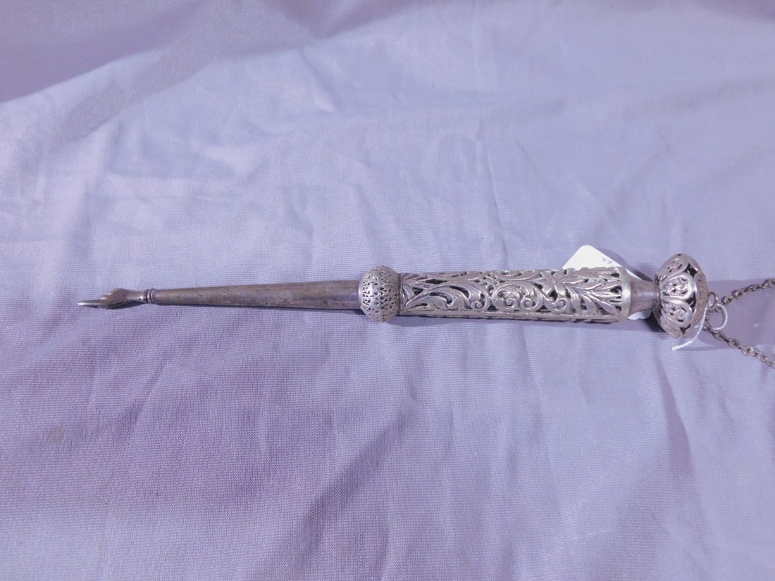 Torah Pointer (Yad): Torah Pointer (Yad), unmarked sterling silver (tested), floral and scroll open work, knob top and handle, chain, 11"l, 3.3 ozts. [62] CONDITION: Light tarnish, a few tiny dings on shaft.