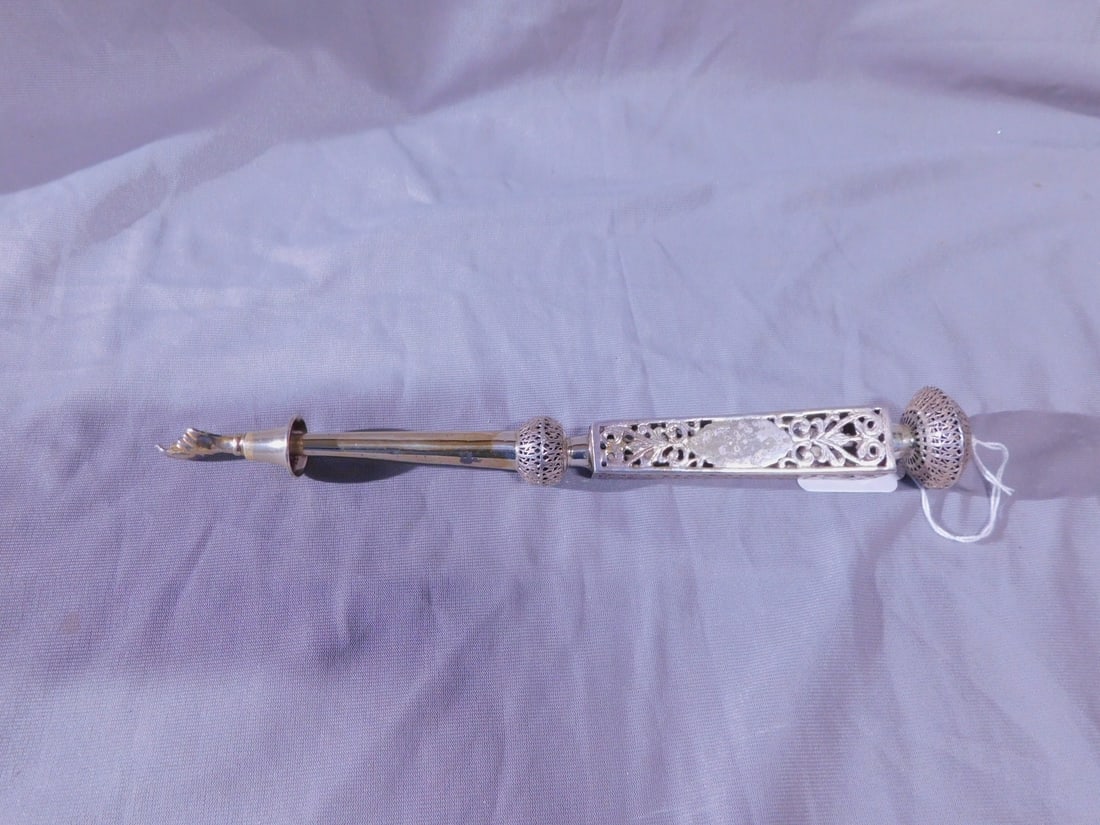 Torah Pointer (Yad): Torah Pointer (Yad), marked sterling silver, filigree knob top on open work cast and chaised four sided handle, cuffed hand, 11 1/4"l, 4.15 ozts. CONDITION: Very good, a few dings.