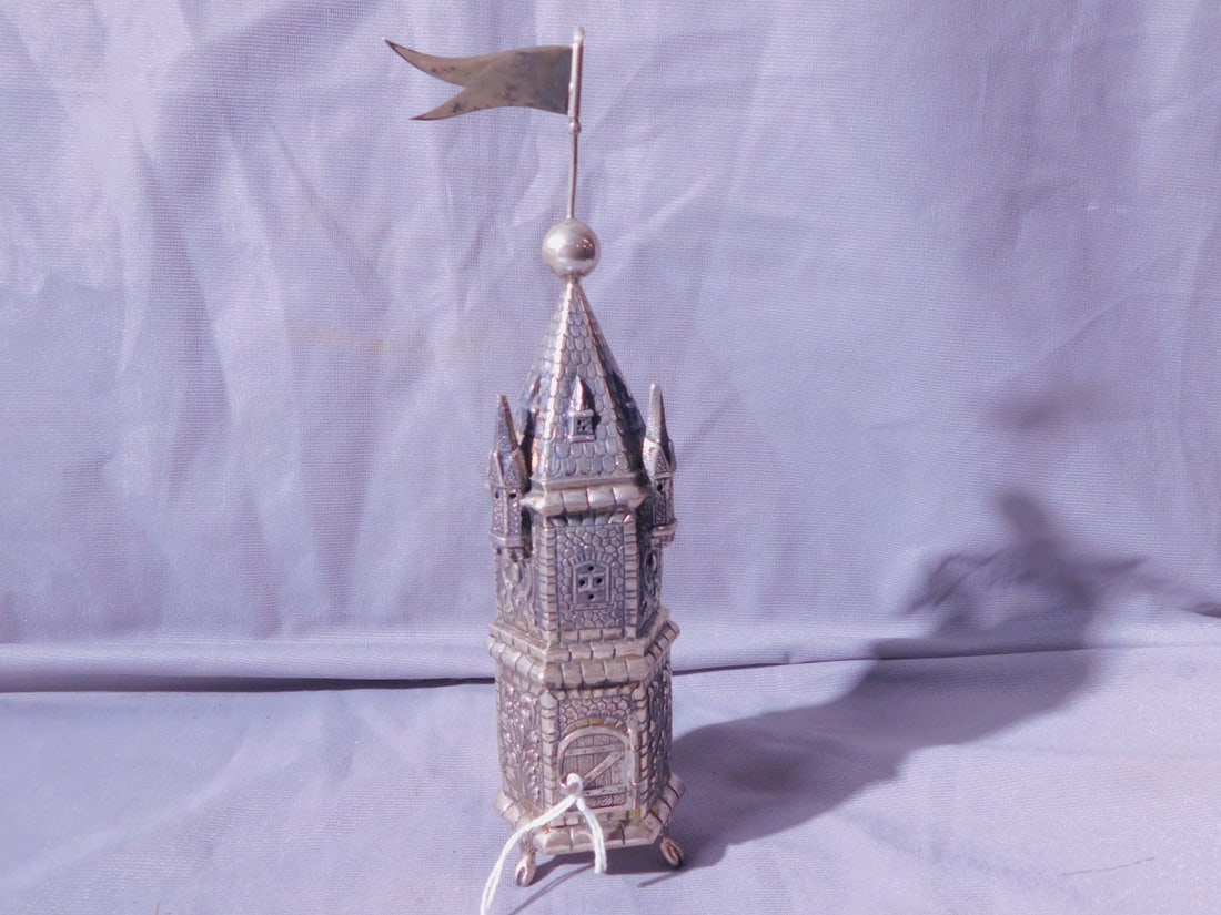 Sterling Spice Tower: Sterling Spice Tower, marked sterling silver; cast and chaised in a three story castle form, crested by a flag, three cabriole legs with claw feet, 8 1/4"h, 5.55 ozts. [225] CONDITION: Very fine.