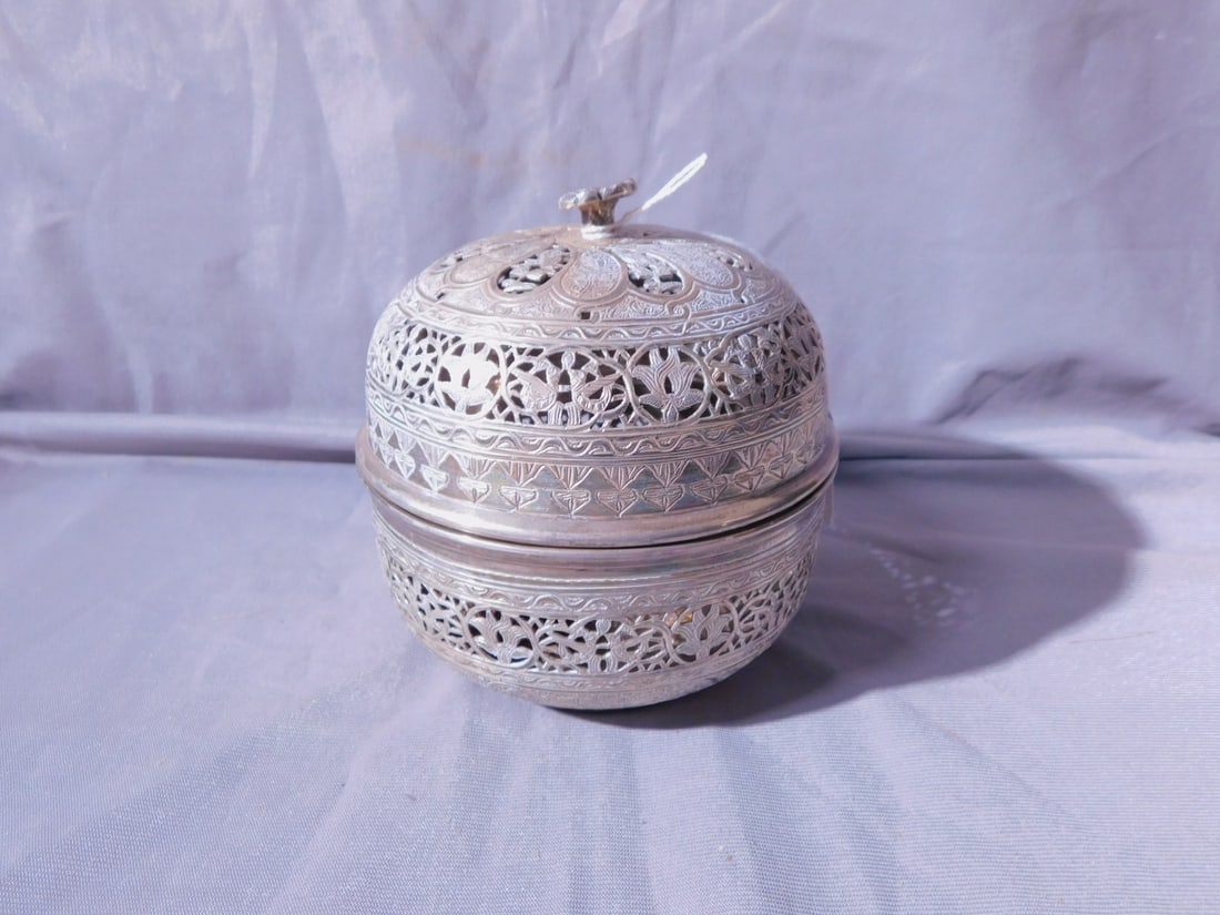 Iraq Silver Etrog Box: Iraq Silver Etrog Box,touch marks on base, approx. 800+ silver purity; elaborately overall reticulated and chaised with doves, scrolls, flowers, medallions, etc., cast flower finial, 19th / 20th C, 5"