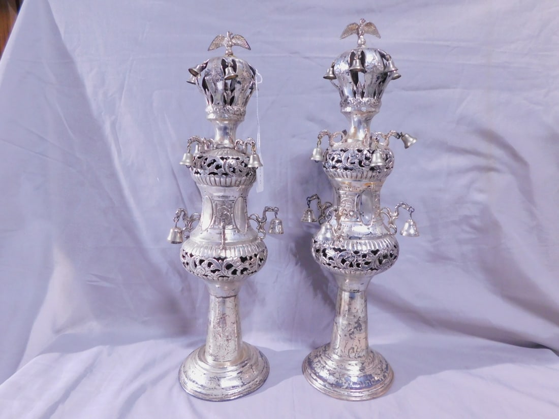 Pr Torah Rimonim (finials): Pair Torah Rimonim (finials), marked sterling silver (tested), pierced, embossed and chaised scroll and rosette motifs; bird crested crown with bells over urn form bodies with bird shaped arms and sus