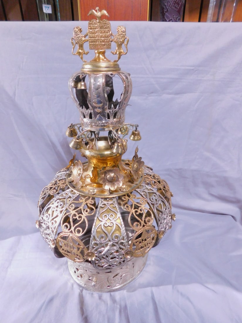 Torah Crown: Torah Crown, marked sterling silver with areas of gold wash, a pair of lions of Judah hold a crowned tablet of laws on a small circle chaised crown with bells upon a larger crown with raised flowers;