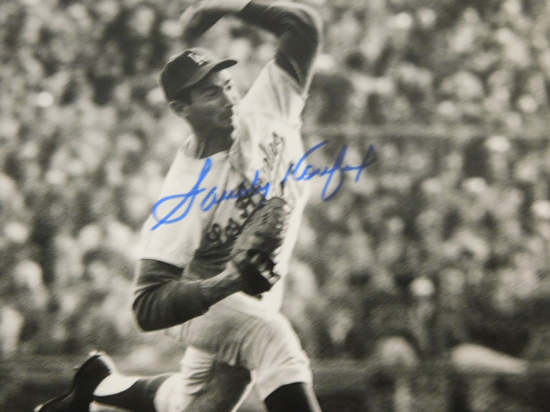 Sandy Koufax signed photo: Sandy Koufax signed photo, Jewish pitcher for LA Dodgers, 8 x10, black and white, action photo (pitching), signed in marker. NOTE: We do not guarantee authenticity of any signature. Condition: very go