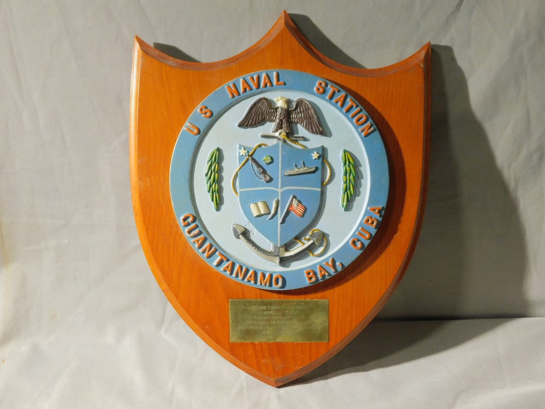 Bronze Painted U.S. Navy Plaque: Bronze Painted U.S. Navy Plaque, U.S. Naval Station, Guantanamo Bay, Cuba blue over light blue with red letters, eagle on anchor under shield with ship, rifle, ledge and flag, 7 5/8"d, with brass pres
