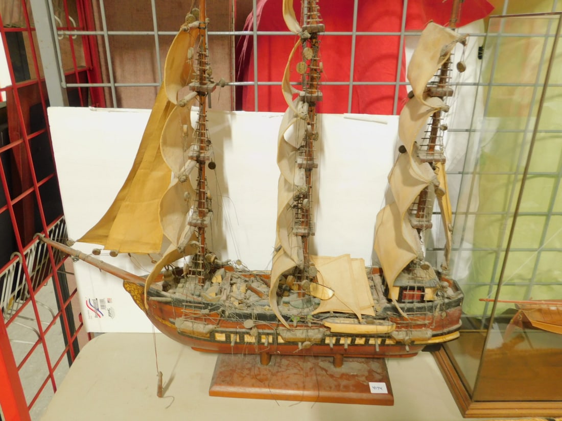 Wood Sailing War Ship Model: Wood Sailing War Ship Model, three mast square sails,side gun port along sides under rails, no name on side of ship, 34"l, on two bottom poles and wood base. CONDITION: J.b boom detached (broken off b