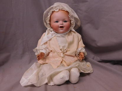 Kiddie Joy Bisque Head Baby Doll: Kiddie Joy Bisque Head Baby Doll, Germany, blue sleep eyes, open mouth with waggly tongue, molded hair, cloth body with celluloid hands, early 20th C, approx 16"h, lace trimmed lien gown, cap and unde