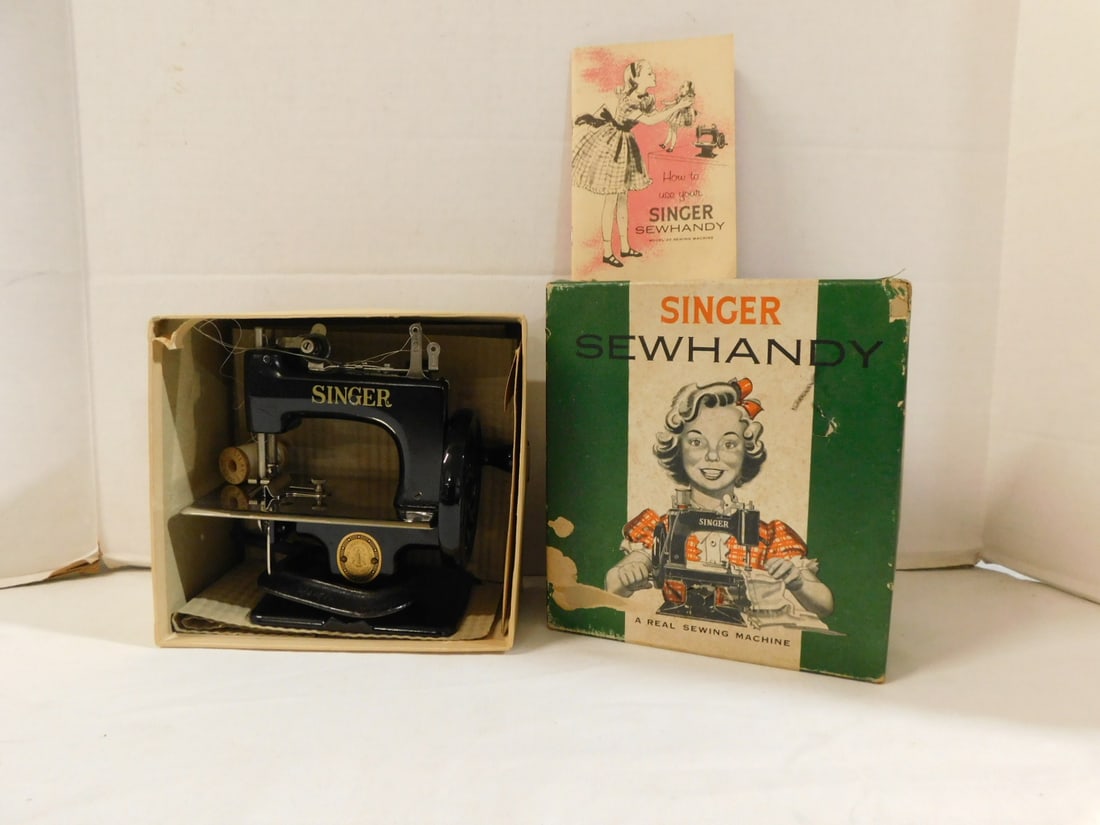 Vintage Singer Sew Handy with box: Vintage Singer Sew Handy with box, model No. 20 with needles in pack, clamp, How to Use book, all in original box. Condition: excellent, box has some wear and minor loss