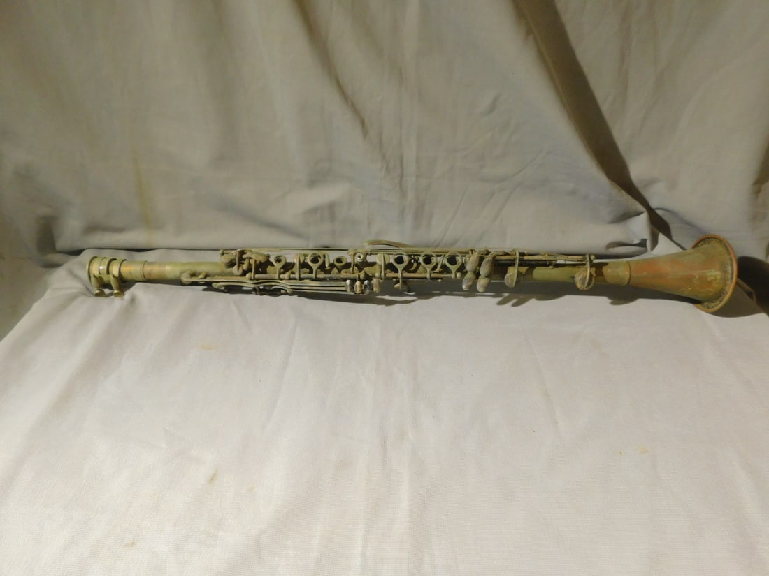 Henton - Knecht Metal Clarinet: Henton - Knecht Metal Clarinet, Phila,1920 - 1938, brass 23 1/2"l. CONDITION: Tarnished, needs cleaning, missing mouth piece, as is.