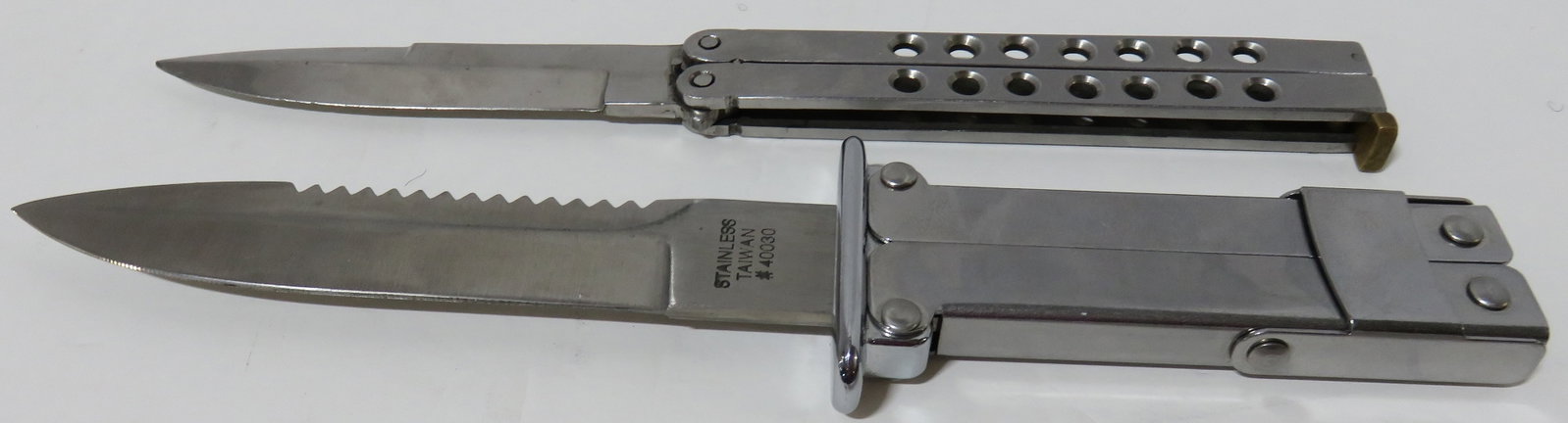 2 Stainless Steel Folding knives: 2 Stainless Steel Folding knives including: Pakistan, 5 1/2" (folded) knife, 9" overall length, plus Taiwan #40030, stainless steel Paratrooper type fold out knife , 7" (folded), saw tooth blade back,