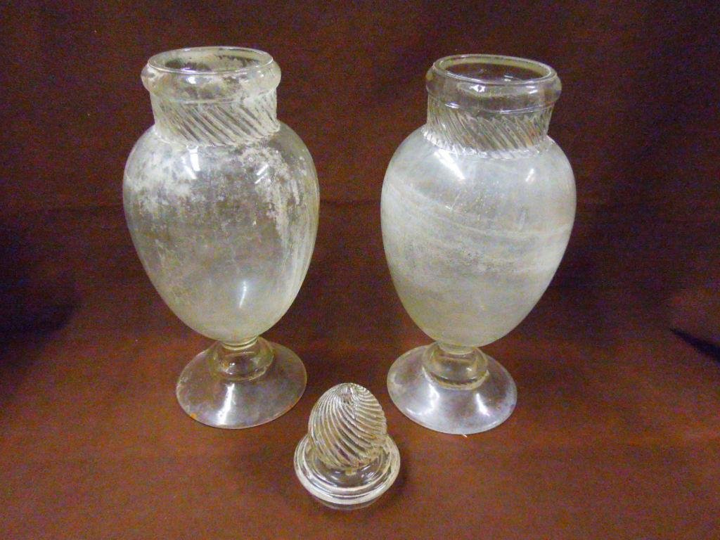 Antique Glass Apothecary Jars: Pair of antique glass 15" Drug Store Apothecary jars. CONDITION: Both have cloudiness residue build up, 1 is missing a lid.