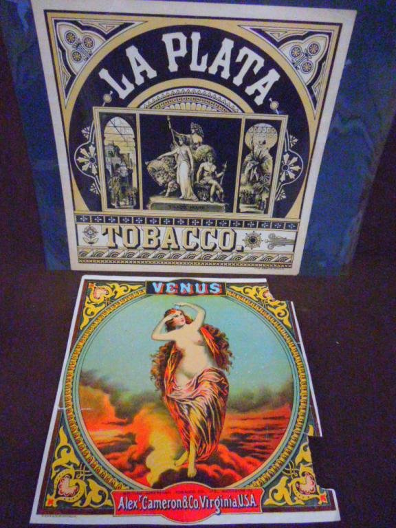 19th c. Tobacco Trade Signs: Two 19th c. lithographed paper tobacco trade signs, 9 3/4" x 9 1/4" British American Tobacco Co., Ltd., Successor to Alexander Cameron & Co. Virginia, titled "Venus" & 10 1/2" x 10 1/2", La Plata Toba