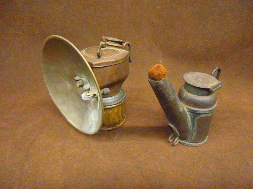 Antique Coal Miner's Lamps: Antique Streamline Justrite & Crown Trade marked small size coal miner's lamps. CONDITION: Both have areas with wear, dents and or loss.