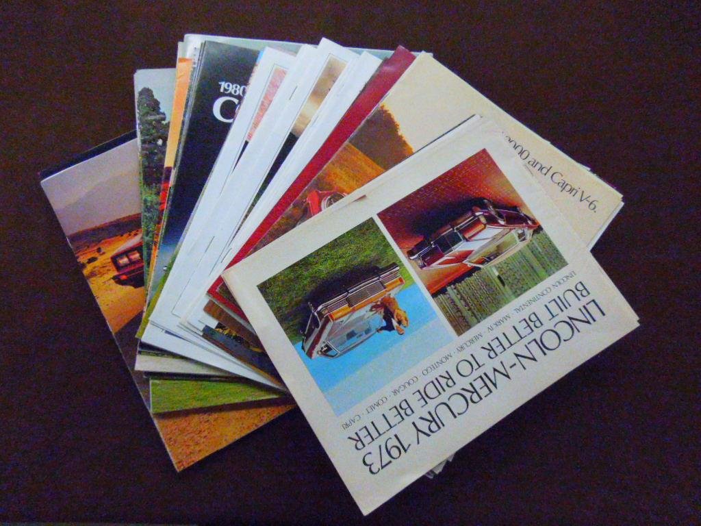 1973-1980 Lincoln Mercury Dealership Brochures: Lot of thirty seven assorted 1973-1980 Ford Lincoln Mercury car dealership sales brochures for Capri, XR-7, Bobcat, Cougar, Marquis, Comet & other models. CONDITION: All have some form of wear.