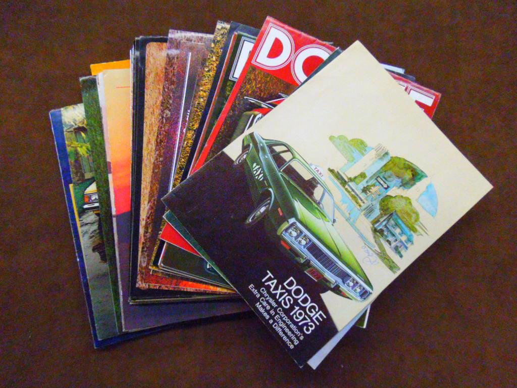1973-1980 Dodge Dealership Brochures: Lot of forty six assorted 1973-1980 Dodge Chrysler car dealership sales brochures for Charger, Challenger, Coronet, Aspen, Omni, Magnum, & other models. CONDITION: All have some form of wear.