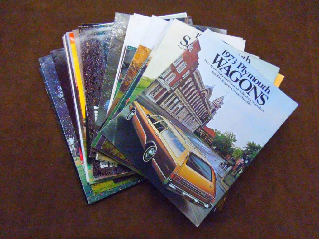 1973-1979 Chrysler Dealership Brochures: Lot of thirty four assorted 1973-1979 Chrysler-Plymouth car dealership sales brochures for Fury, Satellite, Duster, Cordoba, Arrow, Sapporo & other models. CONDITION: All have some form of wear.
