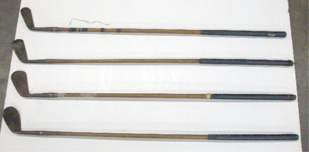 Antique Wood Shaft Golf Clubs: Lot of four antique wood shaft & forged metal end golf clubs, includes: Pro Golfer's Association of America, Reach & two Spalding. CONDITION: All have wear from age & usage.